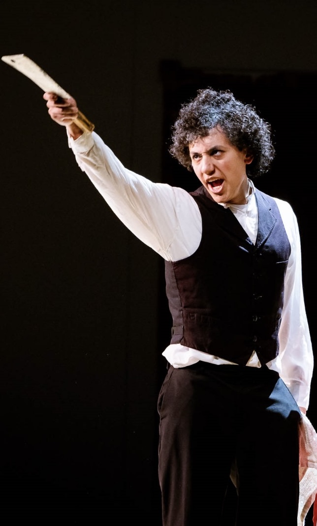 Joshua Soto performing on stage as Sweeney Todd